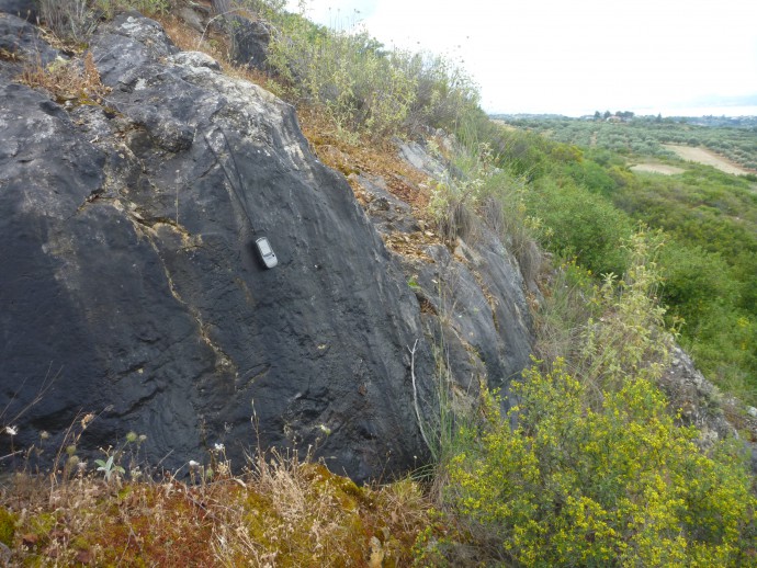 A weathered fault scarp.