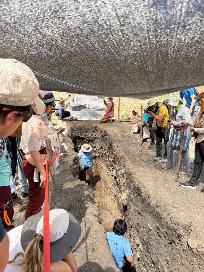 scientists surrounding a paleoseismological trench